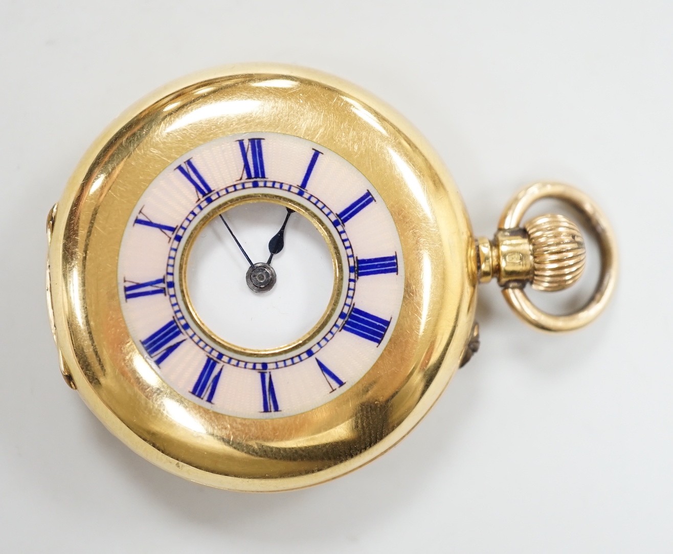 An 18k yellow metal and guilloche enamelled half hunter fob watch, with Roman dial, case diameter 34mm, gross weight 33.7 grams, the case back with engraved monogram.